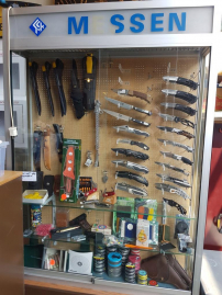 Party knives, bullets, crossbow, etc. with display case from a dump shop