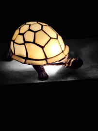 Tiffany style tortoise lamp with stained glass.