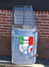 Vintage door of a Vespa with advertising as a deco object😎