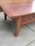 Heavy, solid, rustic, colonial coffee table made of teak